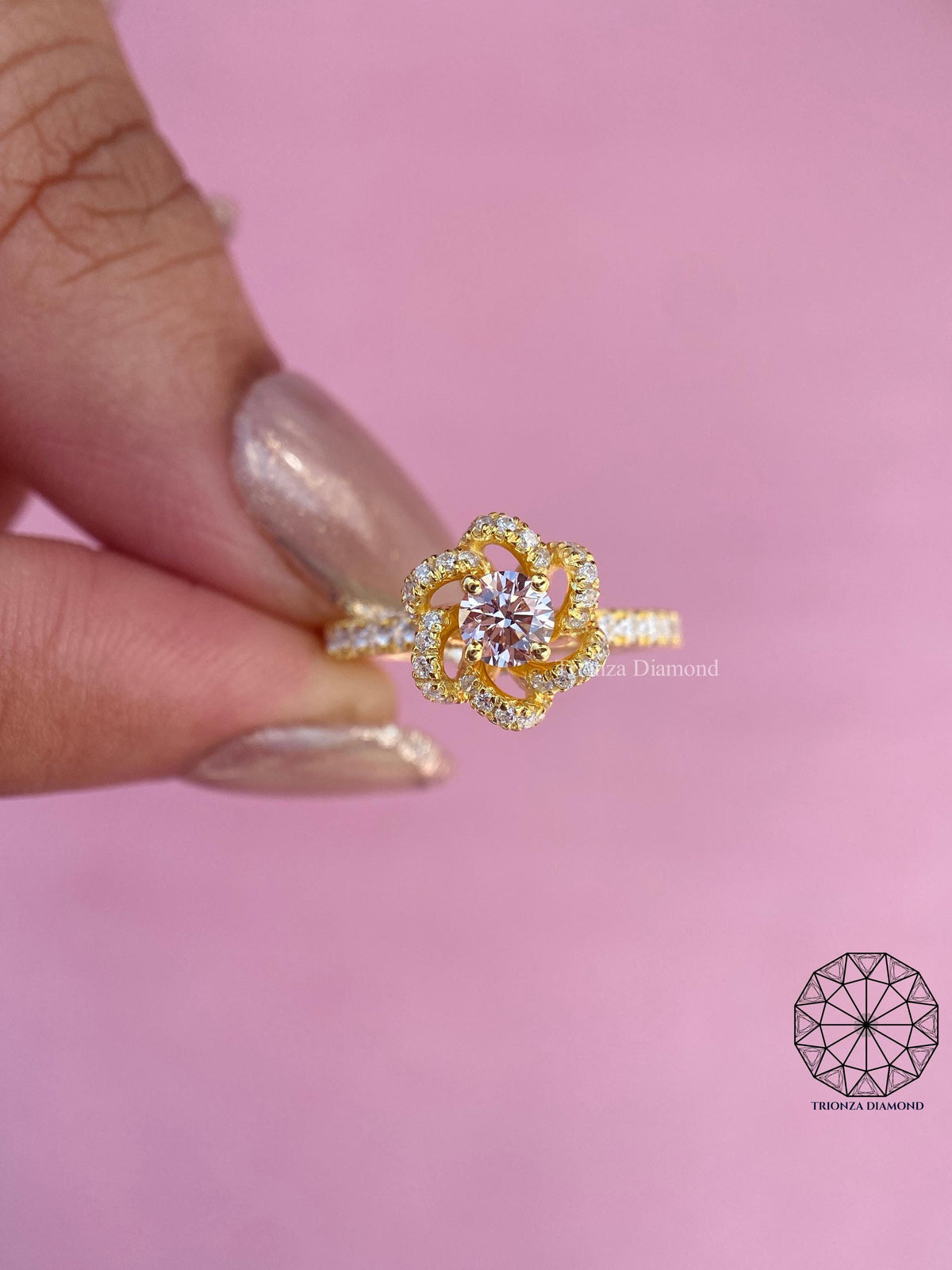 Side view of the nature inspired flower ring highlighting the pave gold band