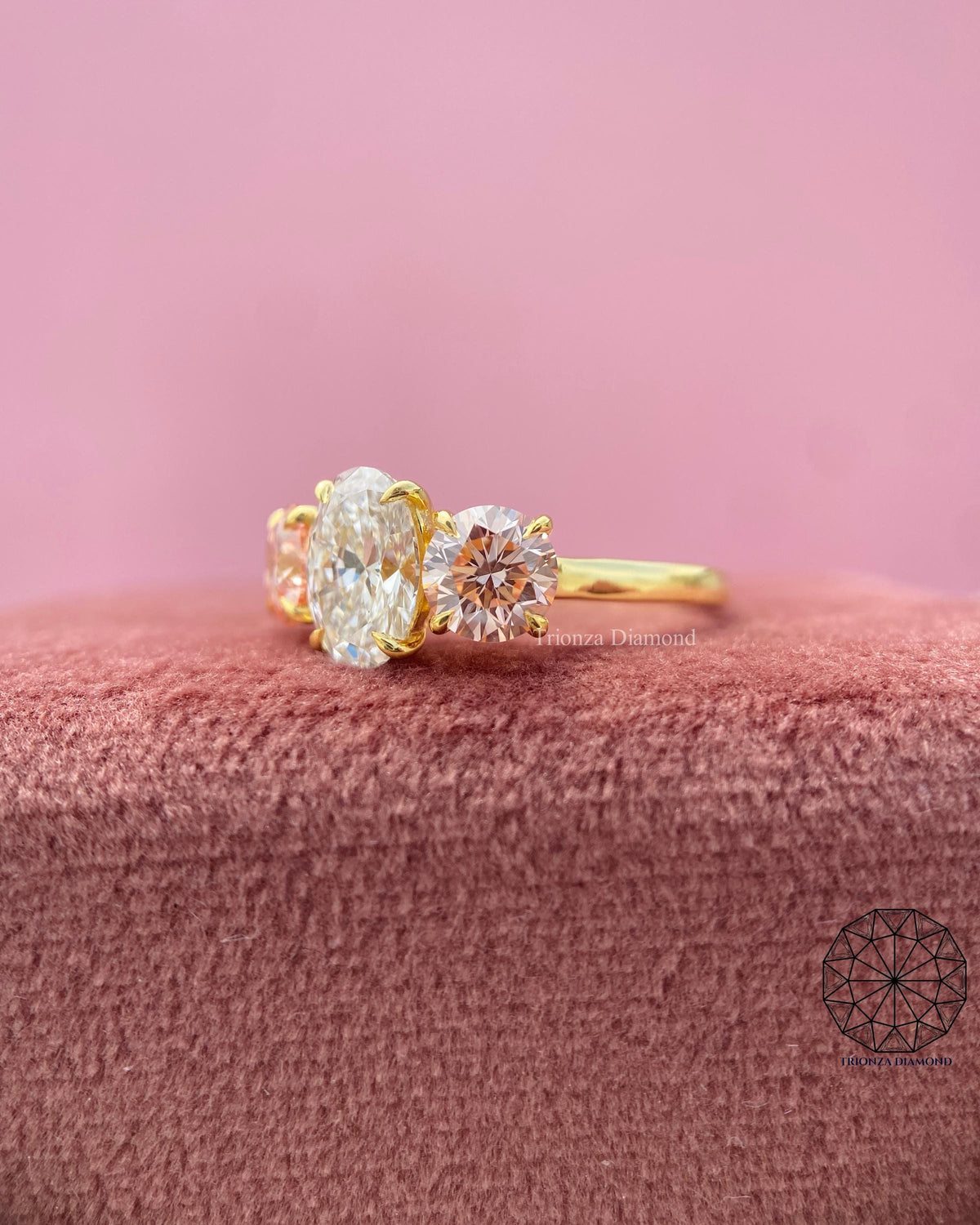 Woman wearing the oval three stone engagement ring, close-up on her hand