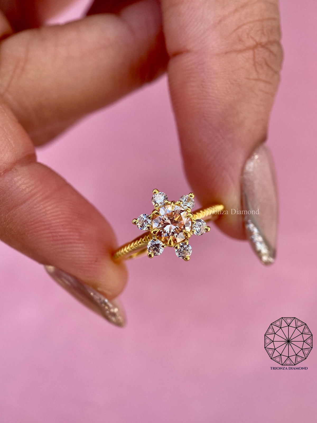 Woman wearing the pink diamond snowflake ring, close-up view on her hand