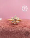 Pink round brilliant cut lab diamond snowflake ring showcasing a delicate pave cluster setting