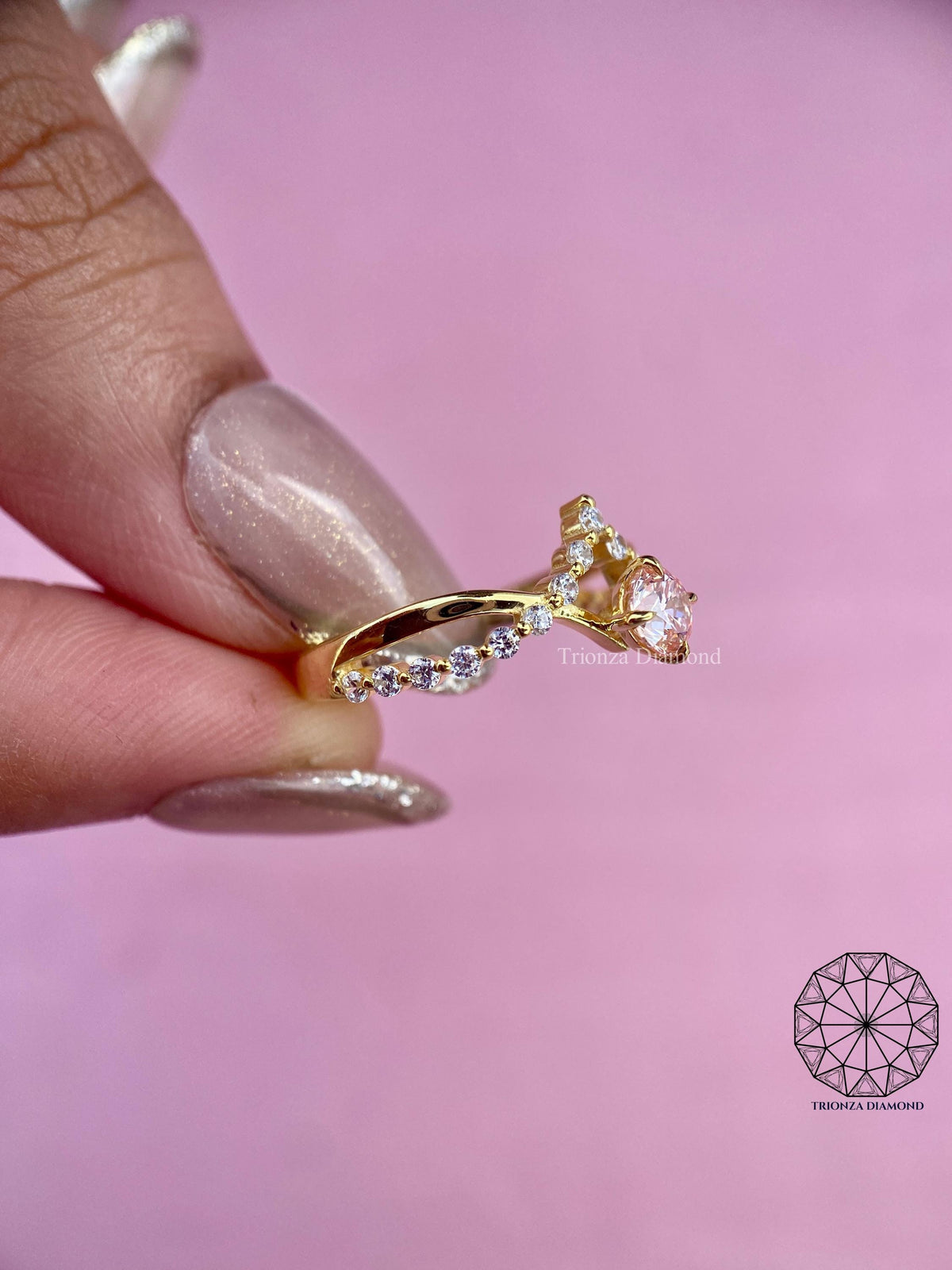 TrionzaDiamond engagement ring designed with a twisted shank for a delicate look
