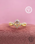 Round pink diamond engagement ring featuring a twisted pave band in 14k yellow gold