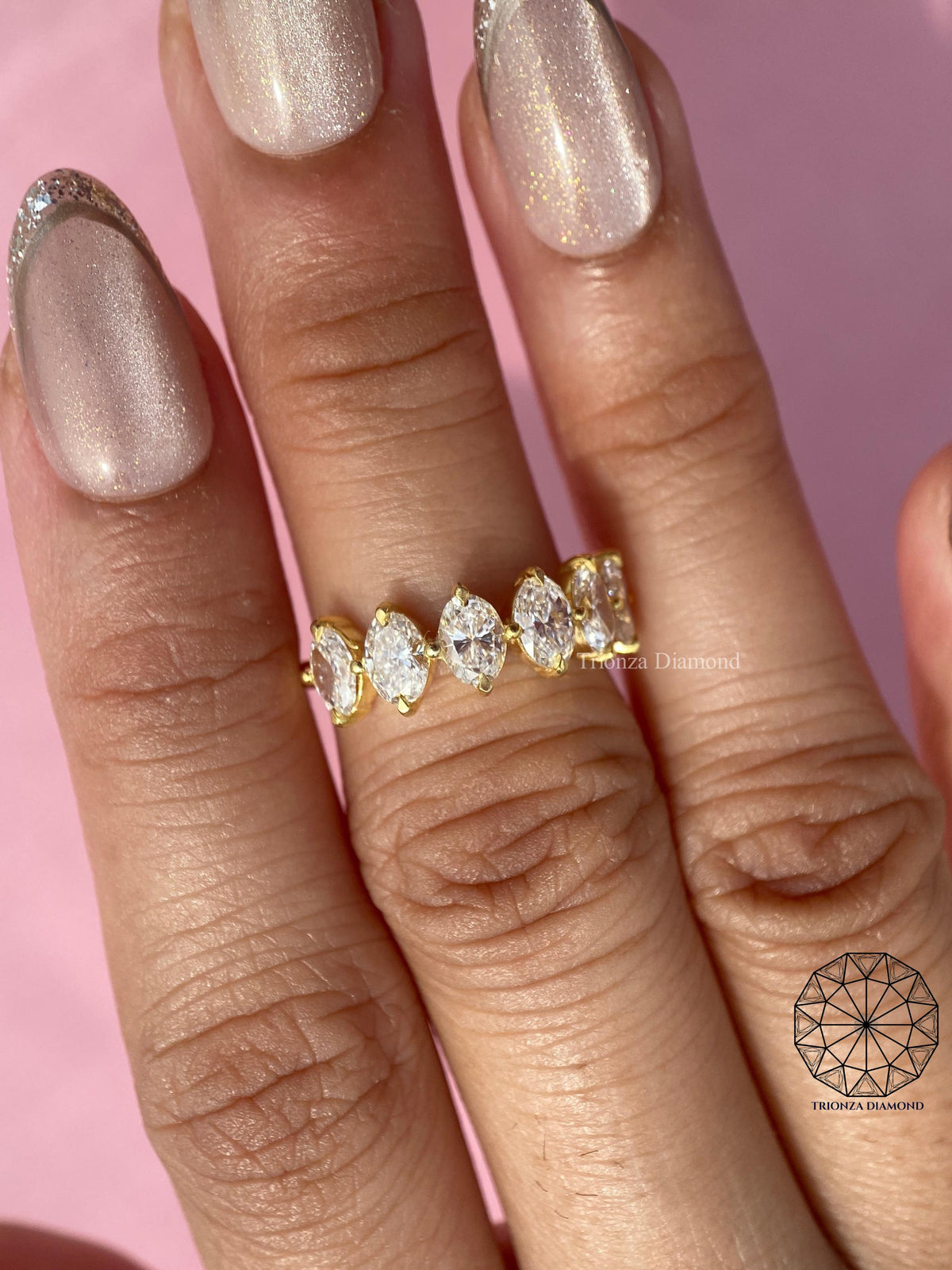 Oval diamond wedding band presented in a jewelry box for gifting