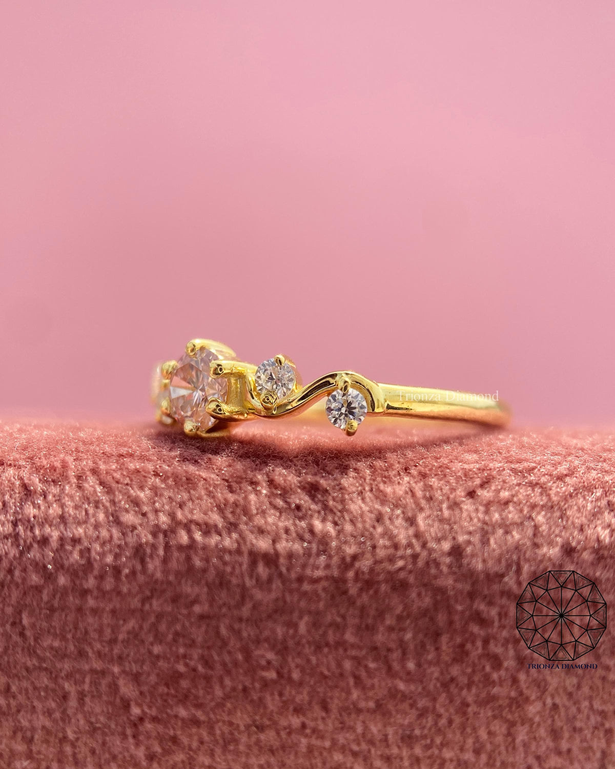 Dainty promise ring displaying the flowing swirl design in yellow gold