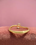 Woman wearing the toi et moi emerald ring showcasing its two stone setting