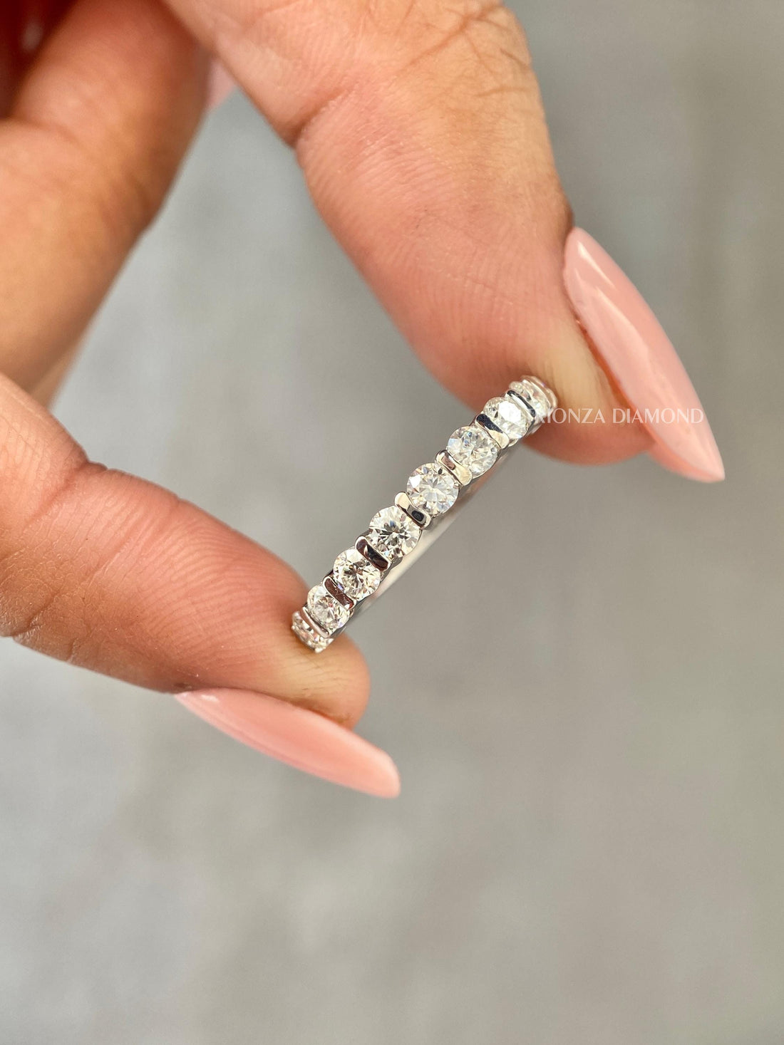 Half eternity lab grown diamond wedding band featuring round cut stones in a floating bubble design