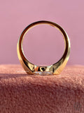 Woman wearing the marquise cut solitaire ring set in an east to west orientation