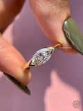 Marquise cut lab grown diamond engagement ring with east to west half bezel setting in yellow gold