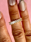 Side view highlighting the 1.57 TCW baguette diamonds set in yellow gold