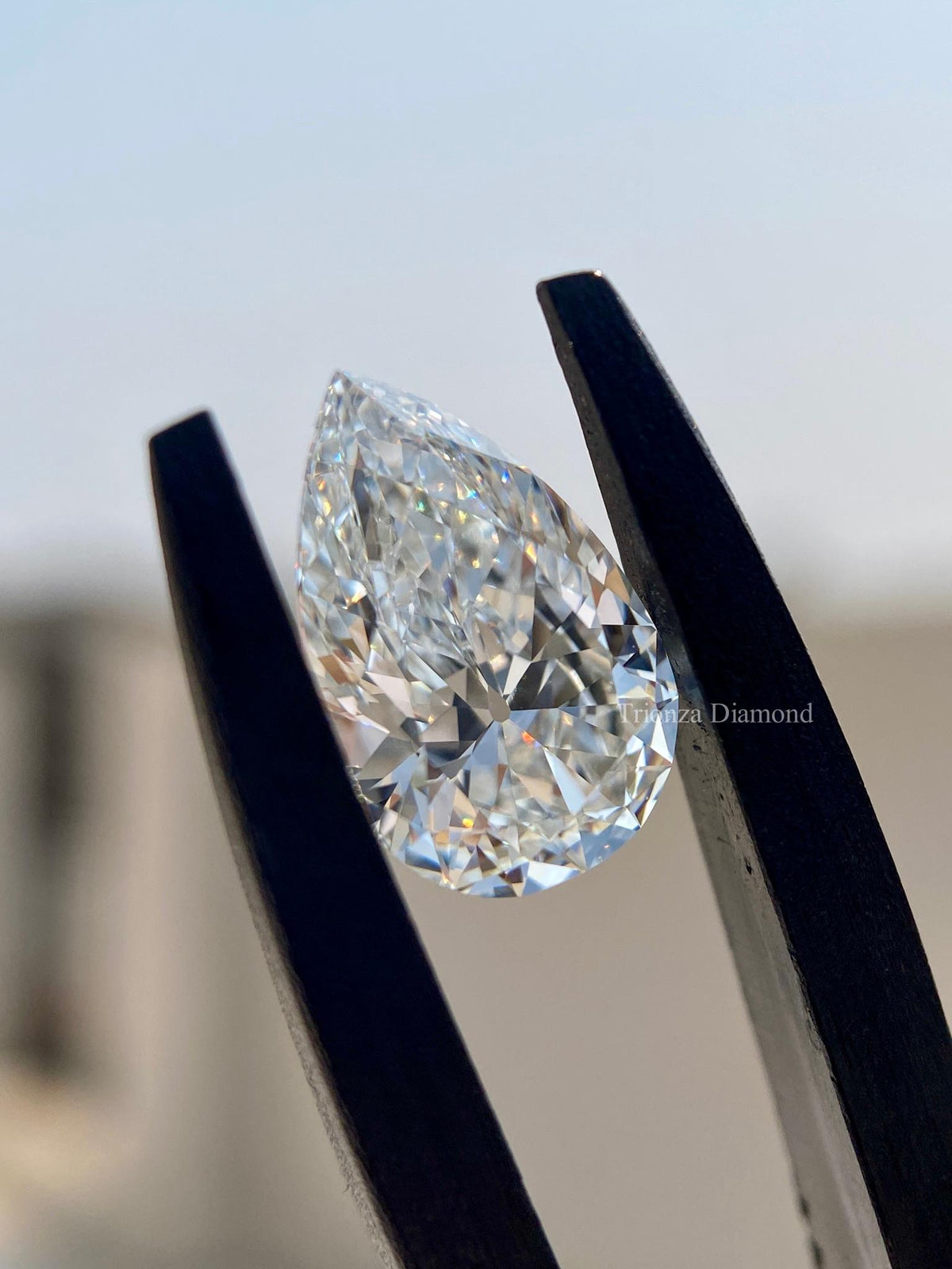 TrionzaDiamond pear cut loose diamond photographed to show its precise measurements and cut