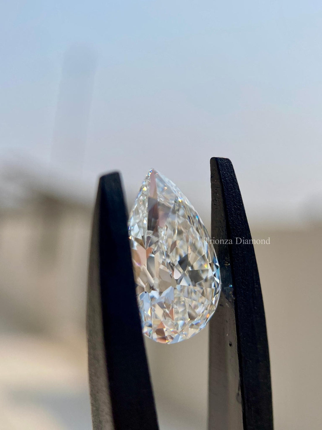 Pear cut lab grown diamond displayed to showcase its brilliance and clean facets