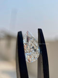 Close-up of the 3.06 CT pear shaped diamond highlighting its F color and VVS2 clarity