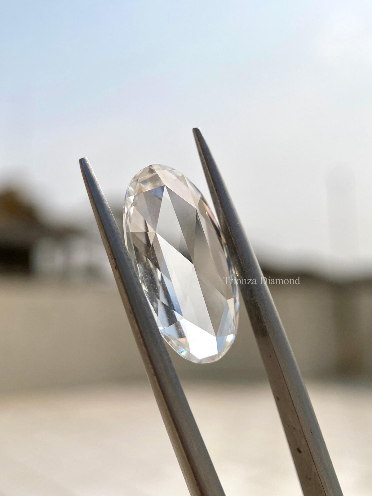 TrionzaDiamond lab grown diamond shown from an angle to reveal its elongated oval outline