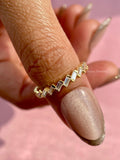 Side view of the ring highlighting the unique bar set baguette cut design