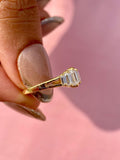 Close-up of the 0.75 TCW baguette cut diamonds set along the split shank band