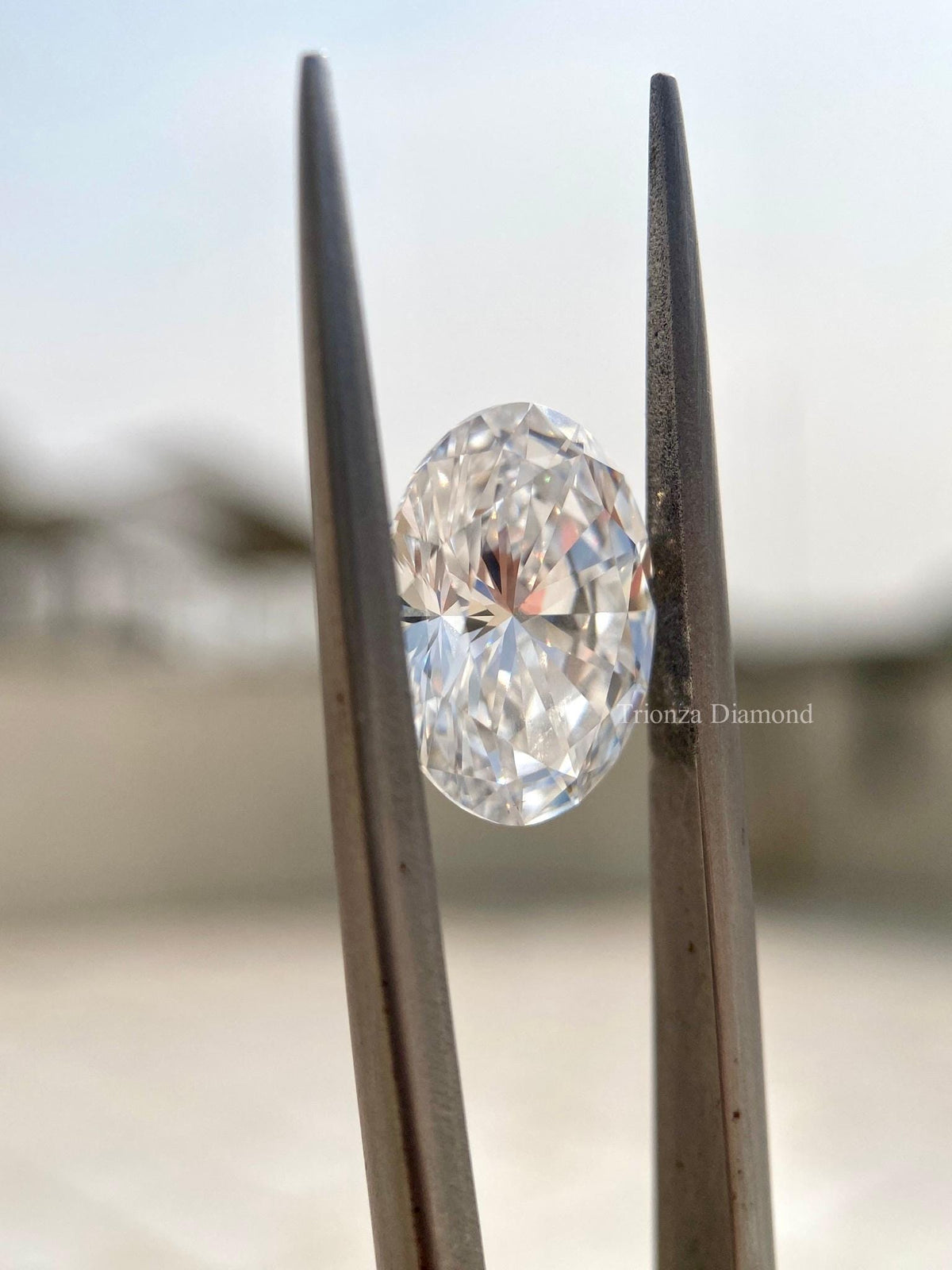 Loose oval diamond shown from the side to display its measurements and depth