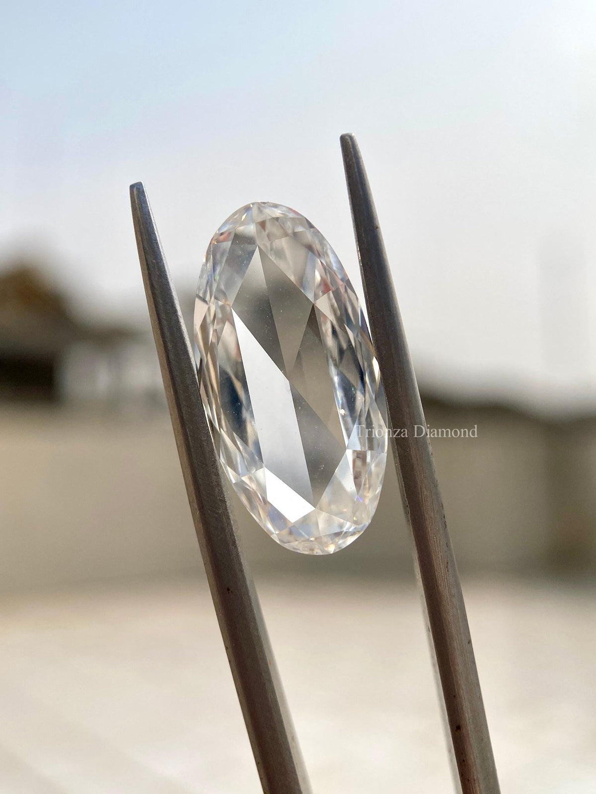Close-up of the 2.80 CT oval rose cut diamond highlighting its F color and VS1 clarity