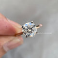 Round brilliant lab grown diamond solitaire ring set in 14K yellow gold with a minimalist band