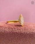 Close-up of the prong set marquise diamond showing the elongated navette halo design