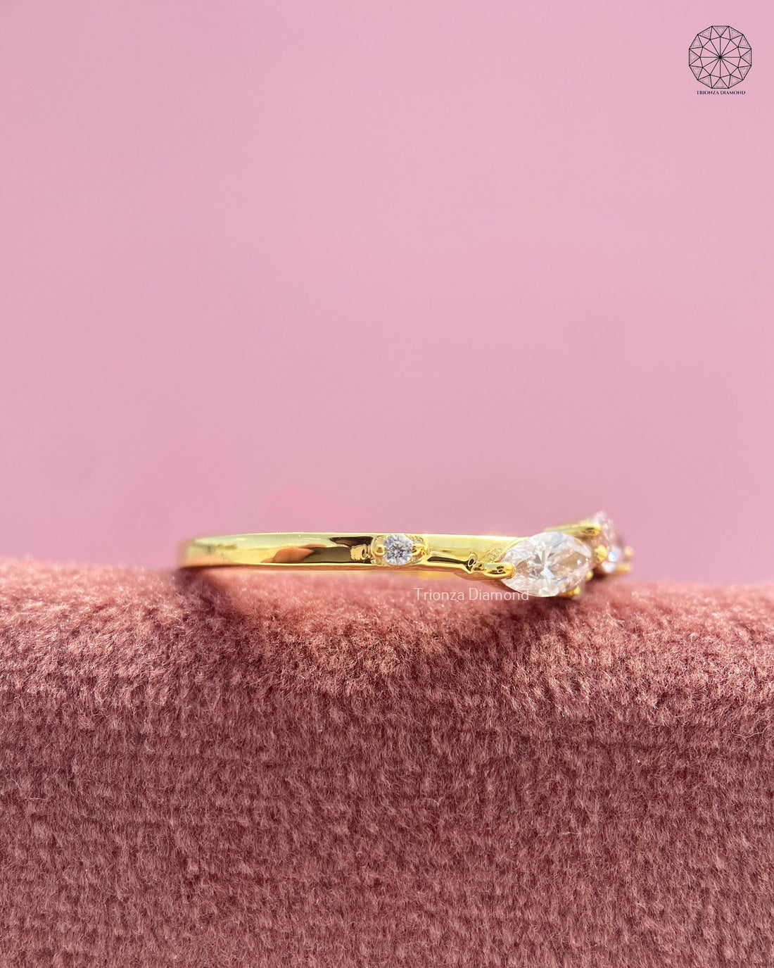 Marquise three stone lab grown diamond ring featuring an east west leaf motif dainty band