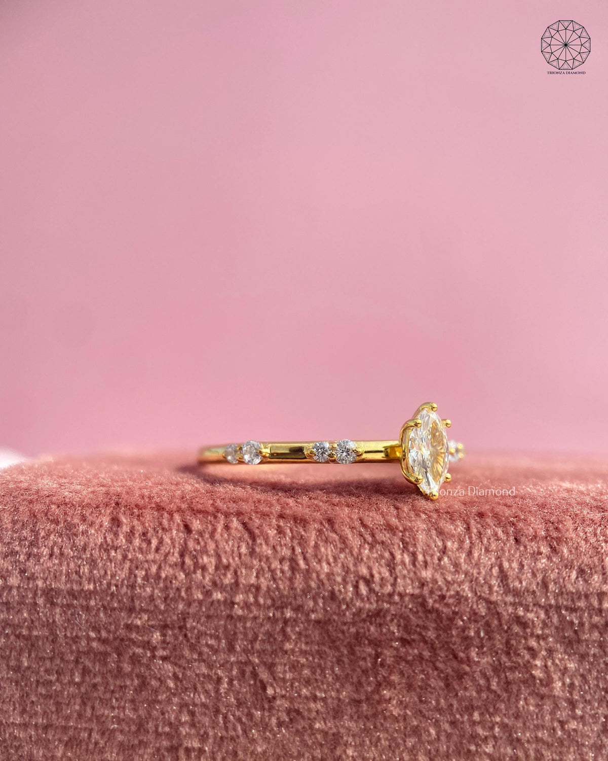 Close-up of the 6-prong double-tip setting securing the marquise solitaire diamond