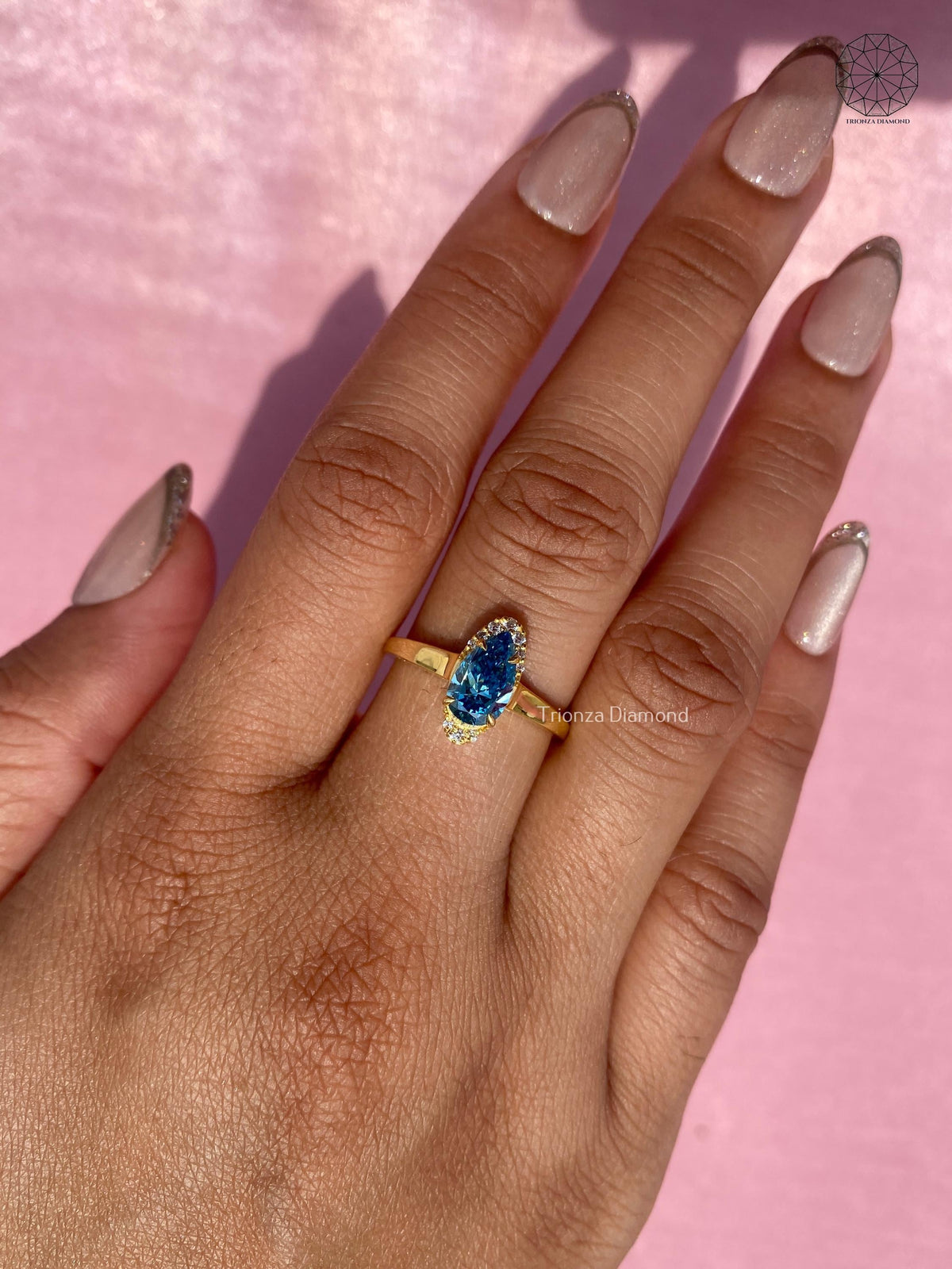 1.06 CT pear halo blue gemstone ring