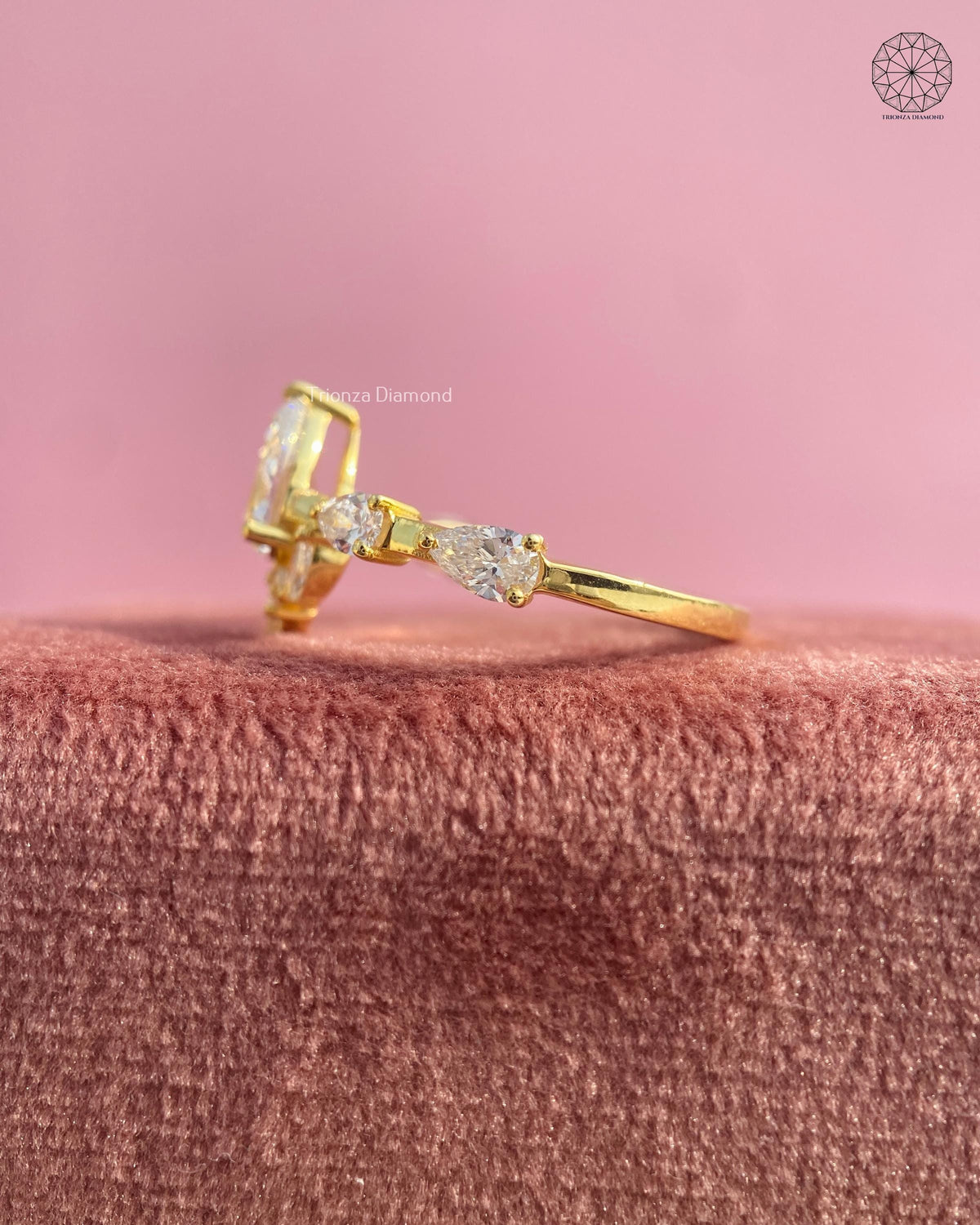 Top down view of the floral cluster ring displaying pear, marquise, and princess cut diamonds