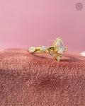 Yellow gold cluster ring with a raised head and slim band for a modern bridal look