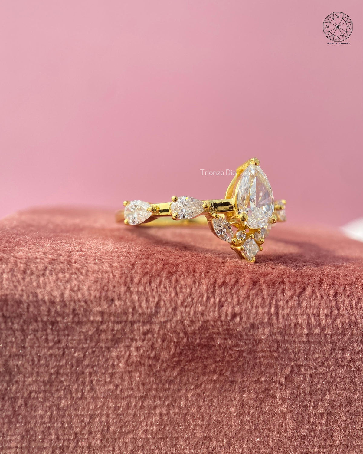 Yellow gold cluster ring with a raised head and slim band for a modern bridal look