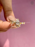 Side view of the ring highlighting the slim band and prong set diamond accents