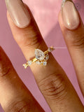 Woman wearing the pear diamond cluster ring, close-up on her hand
