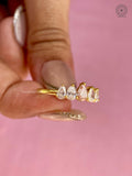 Close-up of the minimalist prong set holding the pear shaped diamonds securely in place