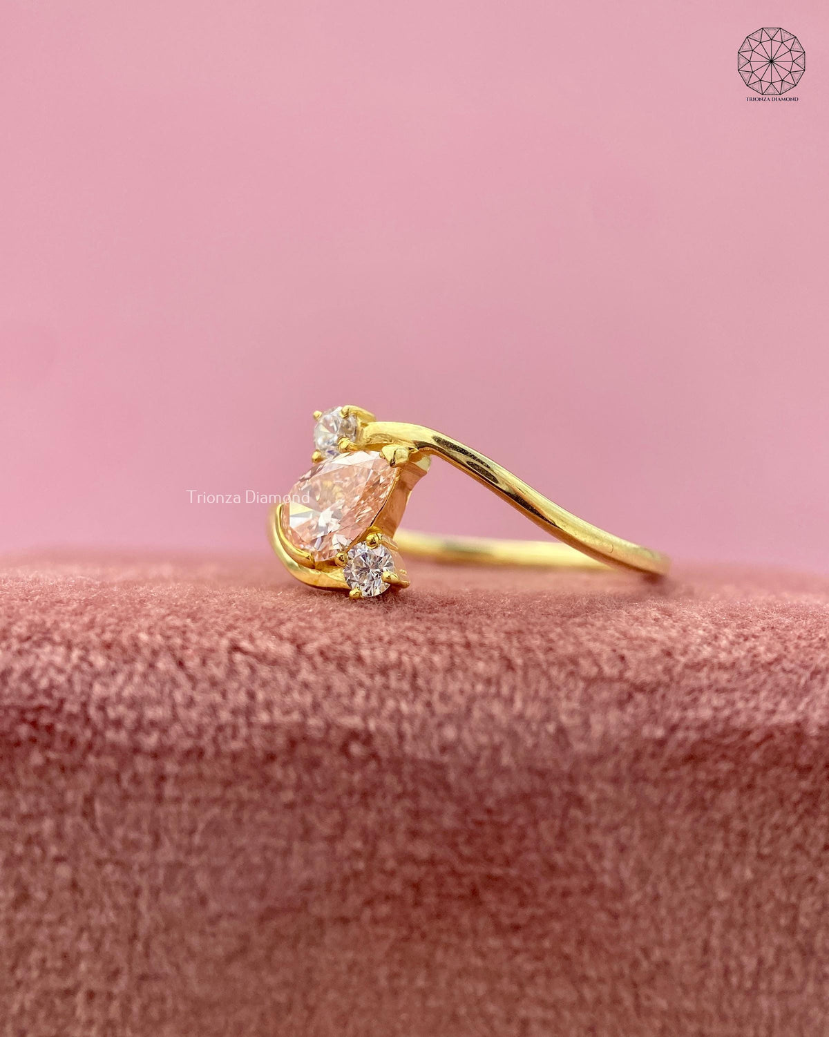 TrionzaDiamond engagement ring crafted with a modern bypass swirl setting in yellow gold