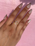 Handcrafted yellow gold bypass swirl ring designed as a unique anniversary or engagement gift