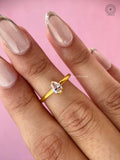 Handcrafted pear solitaire ring displayed to highlight its modern bridal design