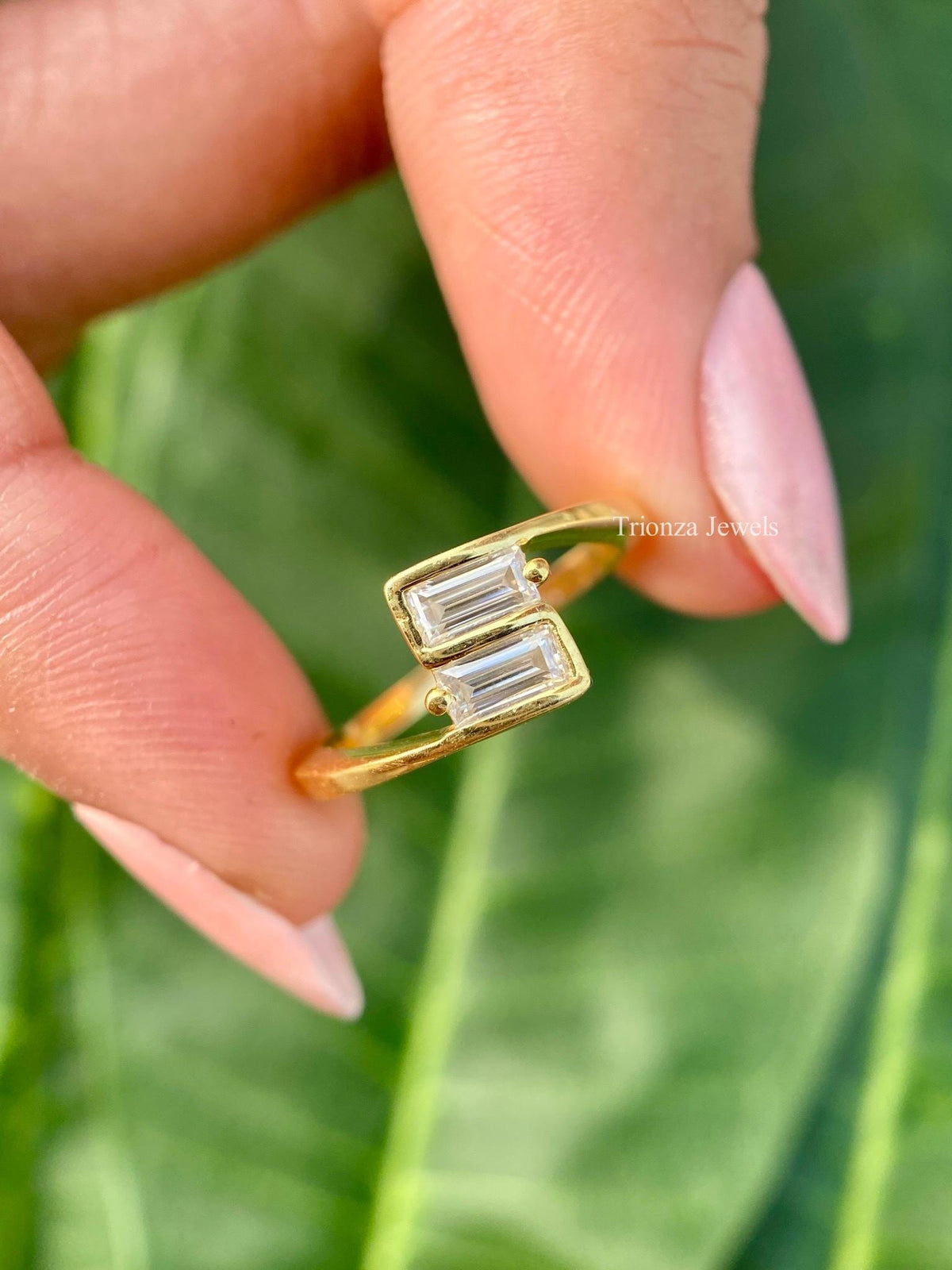 Baguette cut lab grown diamond bypass ring crafted in 14k yellow gold with a minimalist design