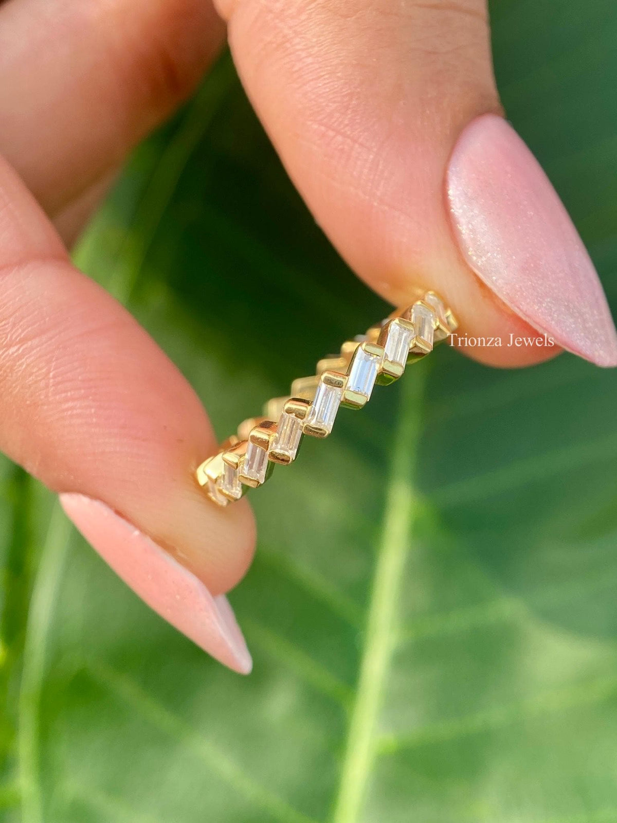 Baguette cut lab grown diamond full eternity band displayed in a handmade design