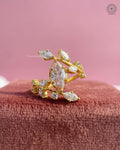 Marquise cut lab grown diamond cluster ring featuring a yellow gold botanical vine leaf design