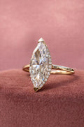 Elongated marquise cut lab grown diamond ring displayed in a solitaire 14K gold setting