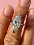 Close-up of the marquise diamond ring highlighting its E color and VVS1 clarity