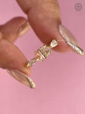 Asymmetrical antique diamond cluster ring featuring champagne cadelic and pear cut lab grown diamonds