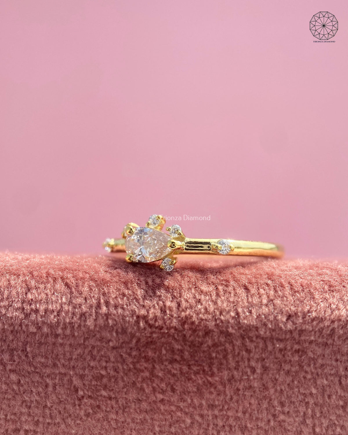 TrionzaDiamond pear diamond ring crafted with a minimalist floral cluster design