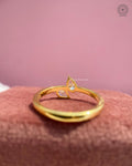 Woman wearing the dainty pear diamond toi et moi ring on her hand