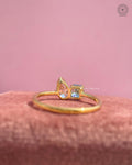 Pink pear cut diamond and blue Asscher cut diamond set side by side in a toi et moi design