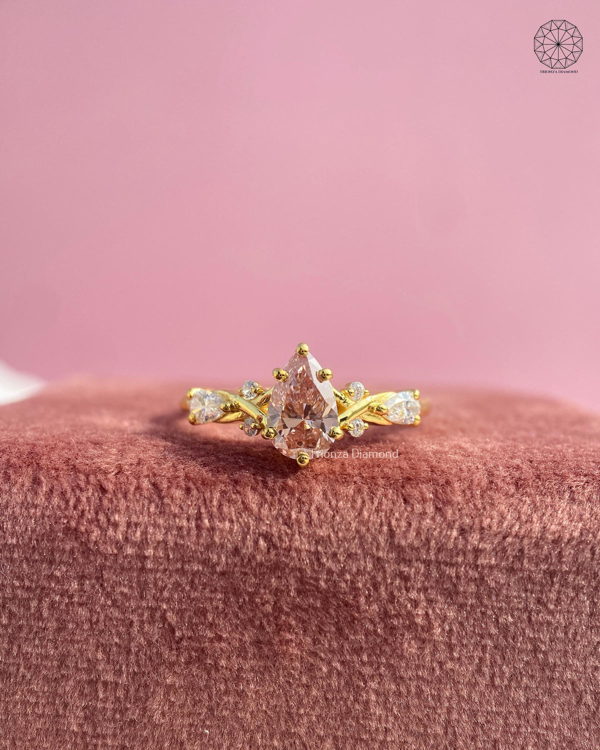 TrionzaDiamond three stone pear diamond ring crafted with floral leaf vine inspired details