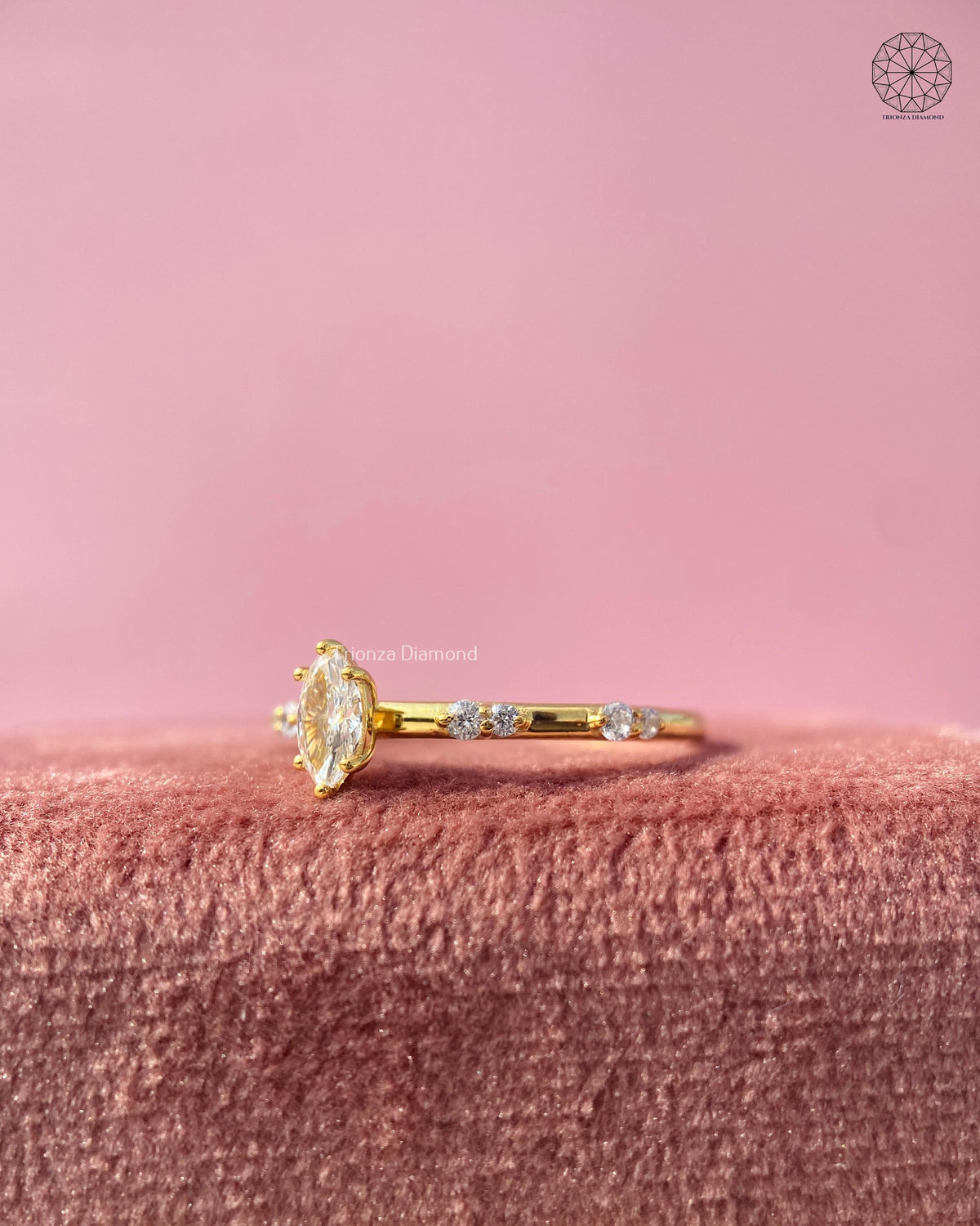Woman wearing the marquise diamond solitaire ring, close-up view on her hand
