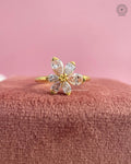 Daisy inspired flower ring showcasing a beaded center and pink tourmaline gemstone detail