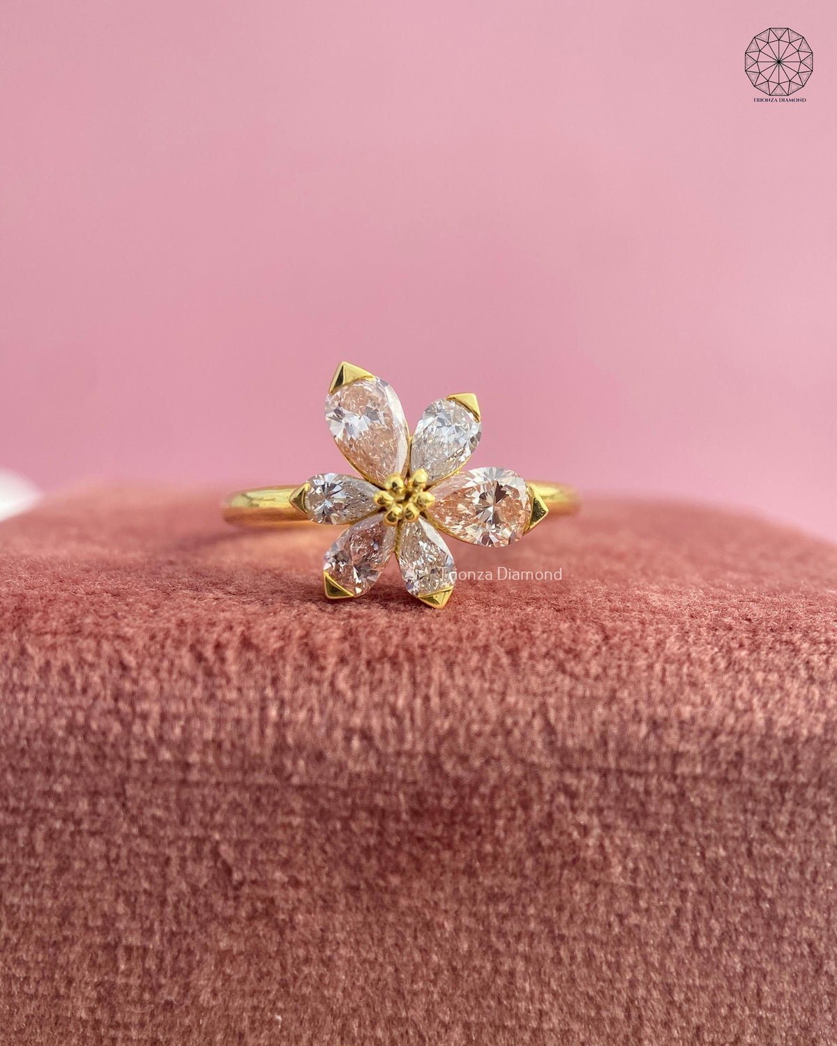 Daisy inspired flower ring showcasing a beaded center and pink tourmaline gemstone detail