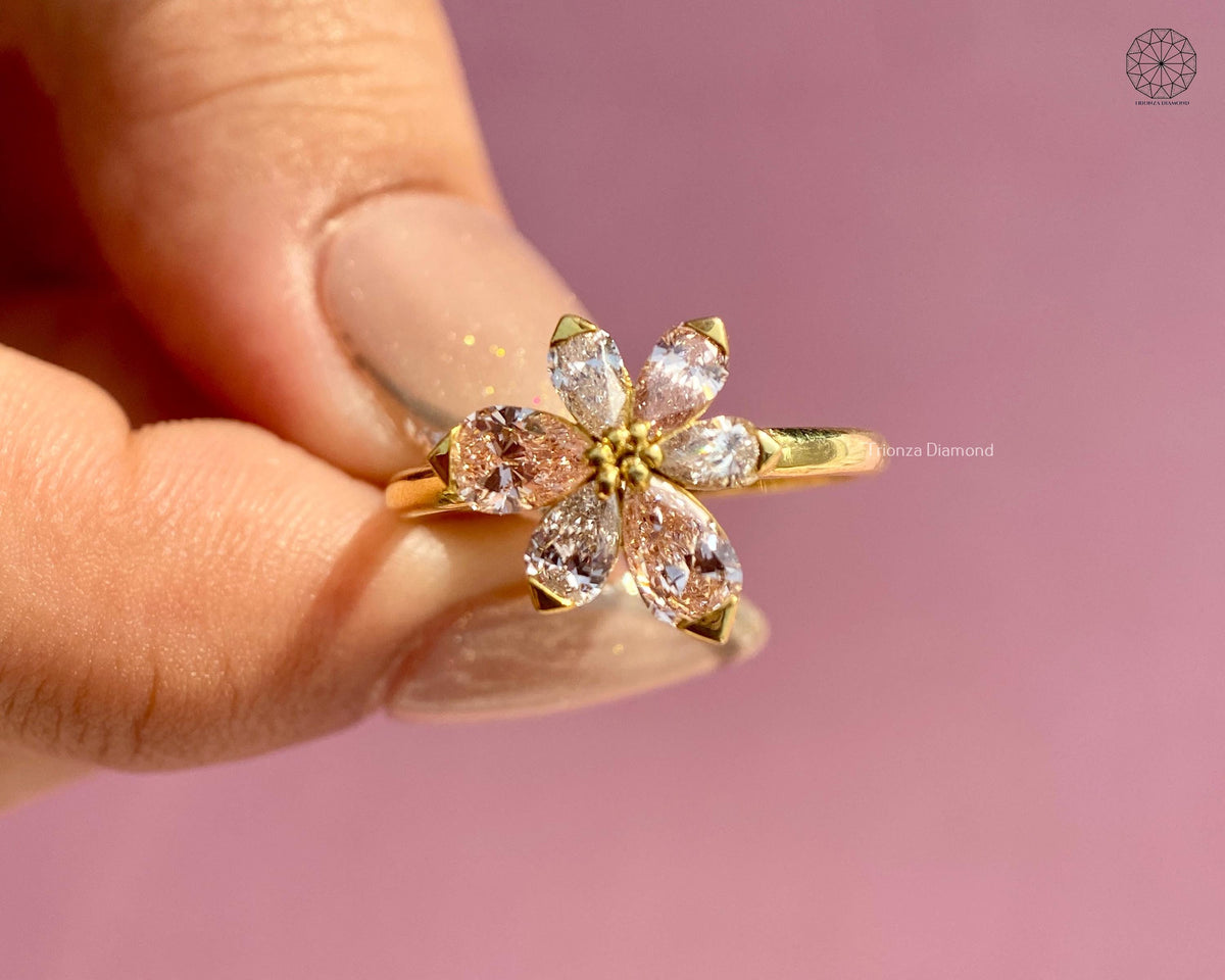 Close-up of the V-prong petal setting holding the pear cut diamonds securely in place