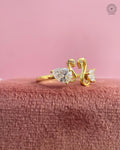 Close-up of the round diamond eyes accenting the sculptural swan ring design